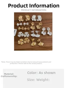 Detailed display of French design floral stud earrings in gold and silver finishes