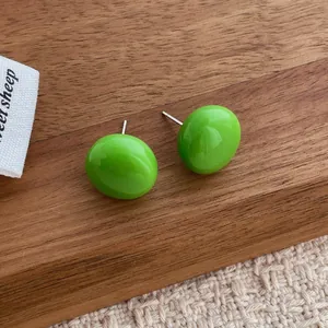 Minimalist grass green oval stud earrings with polished resin finish and silver posts