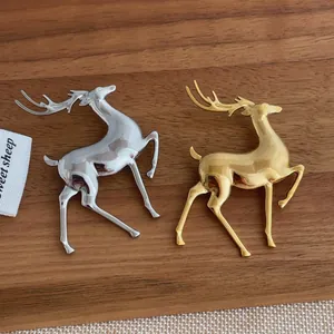 Elegant gold and silver elk brooches in polished metal for stylish suit accessories