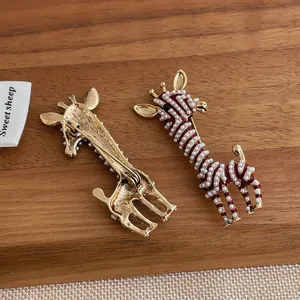 Cute red giraffe brooch with white pearls and gold base, front and back view