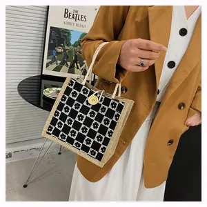 Floral checkerboard canvas tote with woven rope handle and yellow button detail