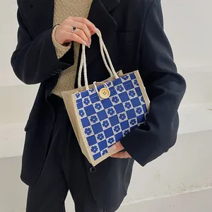 Blue and white floral checkerboard canvas tote bag with wooden button and rope handle