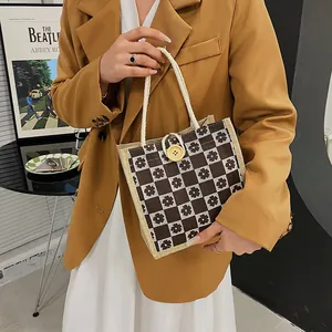 Floral checkerboard canvas tote bag with thick rope handles and yellow button closure
