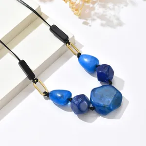 Vintage irregular blue marble resin necklace with golden geometric metal accents
