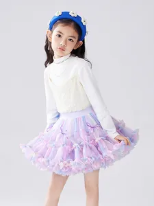 Girl's colorful tutu skirt with vintage knit vest and floral headband for spring