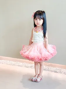 Girl's white camisole and pink layered mesh tutu skirt set with matching accessories