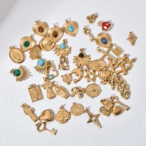Golden stainless steel pendants featuring heart, star, and religious symbols with gemstones