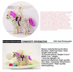 Macro shot of horse keychain with white rhinestones and purple enamel details