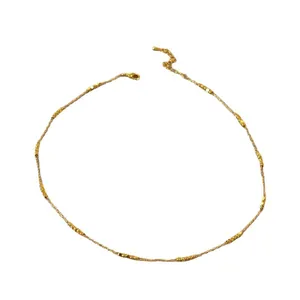 Minimalist gold-plated brass necklace with faceted square beads on adjustable chain