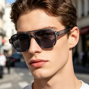 Close-up of men's square sports sunglasses with translucent gray frames and smoke lenses
