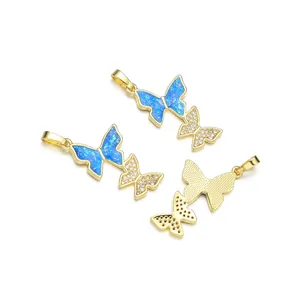 Gold-plated butterfly pendant featuring opal-style stones and pavé cubic zirconia