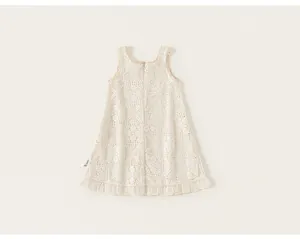 Detail view of cream white sleeveless crochet lace dress for girls with delicate eyelet patterns