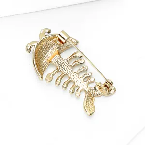Golden fishbone brooch pin made of alloy with textured finish and secure back safety pin