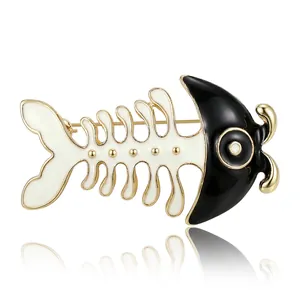 Cute cartoon fish bone brooch with black and white enamel finish in gold plating