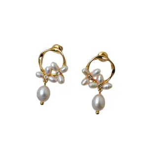 Elegant 925 silver needle floral earrings with freshwater pearls and gold ring accents