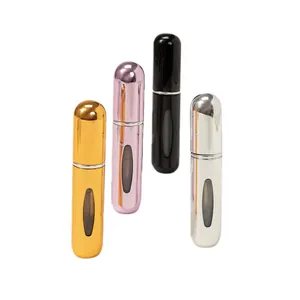 Set of four 5ml refillable perfume spray bottles in gold pink black and silver finishes