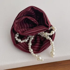 Striped burgundy fabric hair scrunchie with gradient artificial white pearls accessory