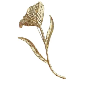 Elegant gold tulip flower brooch featuring vintage petals and detailed leaf textures