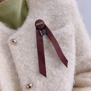 British style coffee brown houndstooth bow brooch with vintage button and long ribbons