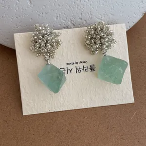 Handmade bead earrings with silver metal beads and light green geometric stone pendants