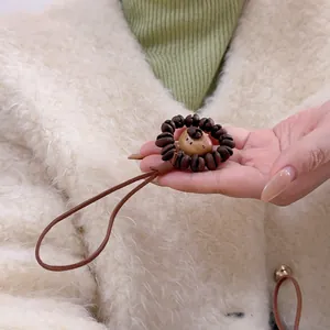 Natural peach wood coffee bean bear charm keychain with brown cord for bags