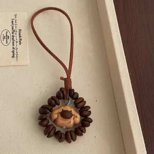 Detail of wooden coffee bean beads and cute puppy pendant charm with leather cord strap