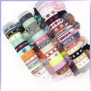 Detailed embroidery on bohemian jacquard wristlets with colorful geometric patterns