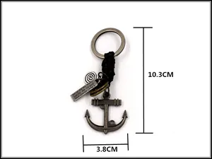 Detailed view of vintage anchor keychain with engraved pendant and braided leather strap