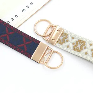 Llavero étnico de cinta jacquard de 25mm con cierres de metal en color oro claro