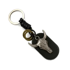 Retro punk leather keychain featuring a vintage steer skull pendant with metal rings