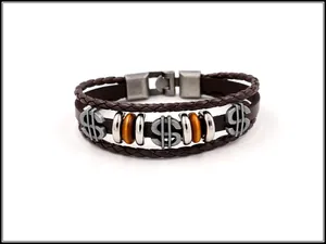Close-up of vintage multilayer leather bracelet with metal dollar signs and wood beads