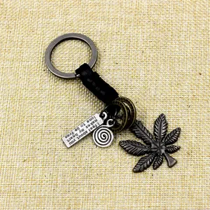 Vintage braided leather keychain with alloy maple leaf and engraved metal pendant charm