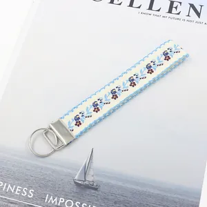 Portachiavi etnico in nastro jacquard da 25mm con ricamo floreale e chiusura in metallo argento