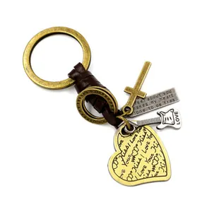 Detail of vintage zinc alloy peace sign keychain with guitar and heart pendants