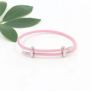 Verstellbares rosa geflochtenes Seilarmband mit silbernem Metallschieber und Verschlüssen