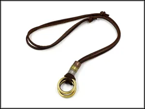 Detail of adjustable leather cord with triple-tone metal rings and double hoop pendant