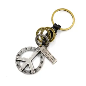 Vintage zinc alloy peace sign keychain with black braided leather and engraved metal tag