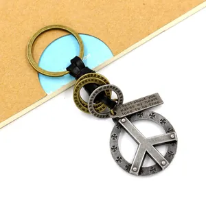 Vintage zinc alloy keychain with woven leather strap and engraved cross charm for men