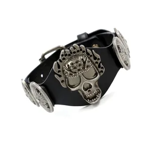 Punk rock wide black leather bracelet featuring silver metal skull and rivet decorations