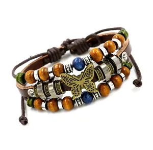 Bracelet multicouche en cuir de style ethnique avec perles en bois et breloque papillon vintage
