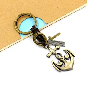Vintage bronze anchor keychain with leather strap, cross pendant and engraved quote tag