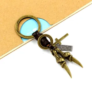 Punk eagle claw keychain with braided leather strap and engraved metal plate in bronze finish