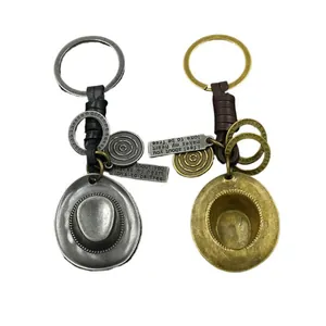 Vintage bronze and silver cowboy hat keychains with braided leather straps set