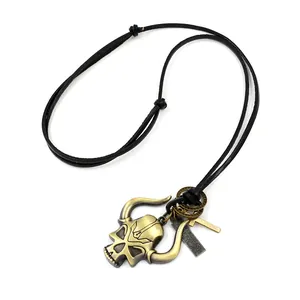 Vintage bronze skull and cross pendant on adjustable black leather cord necklace