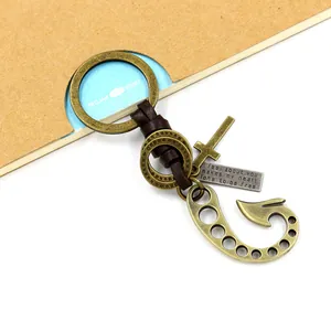 Vintage bronze fishhook keychain with braided leather strap and engraved metal charms