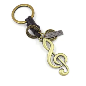 Vintage Bronze Notenschlüssel Schlüsselanhänger mit Lederband und graviertem Anhänger