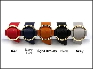 Detail view of five PU leather bracelets in red, navy, tan, black, and grey with gold rings