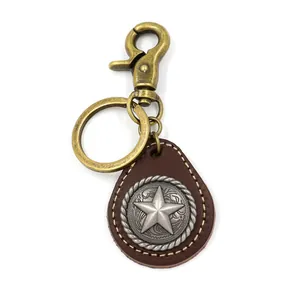 Vintage leather star keychain with brass lobster clasp and deep brown teardrop pendant