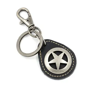 Llavero de cuero trenzado vintage con colgante de estrella y gancho de plata antigua en blanco