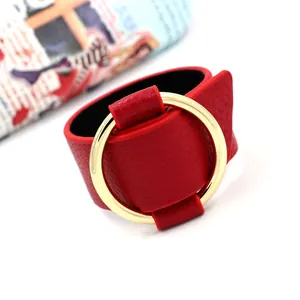 Fashion wide red faux leather cuff bracelet with a large polished gold metal ring accent